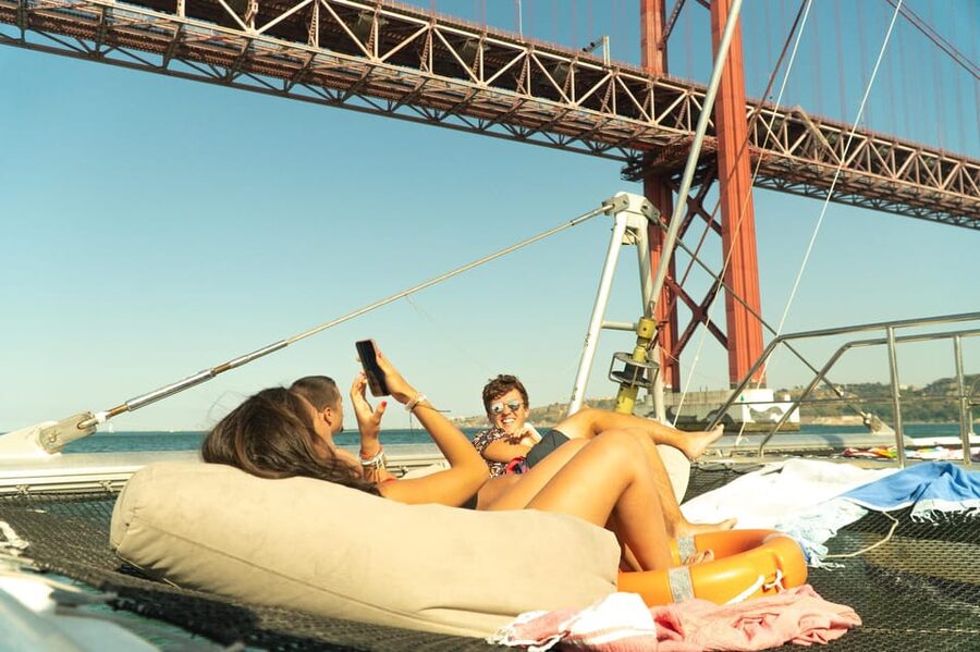 Lisbon: Catamaran Boat Party with Music, Open Bar & Dives - Belém Tower from the Tagus